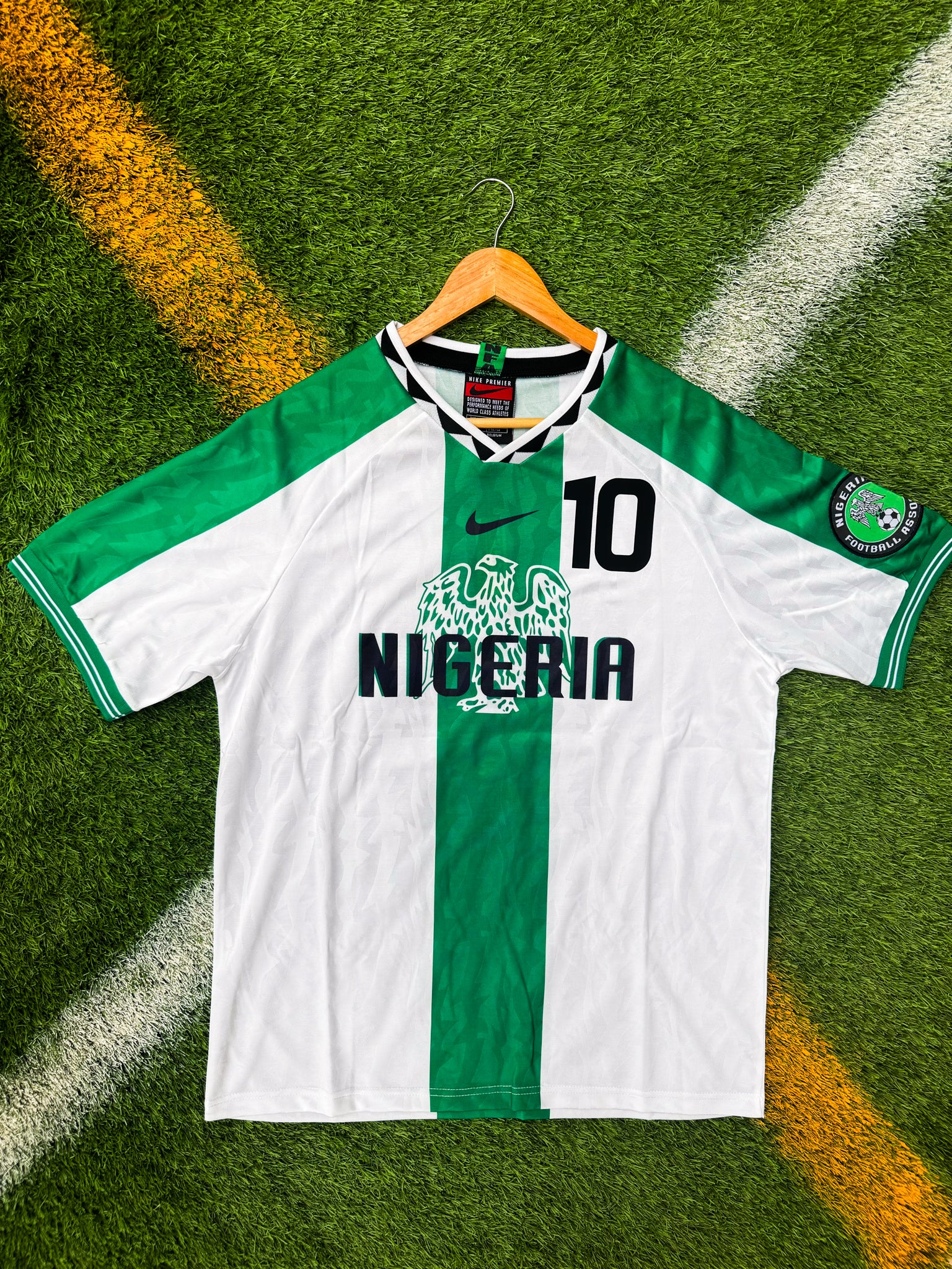 Front of Nigeria 1996 away jersey with green accents on a white base

