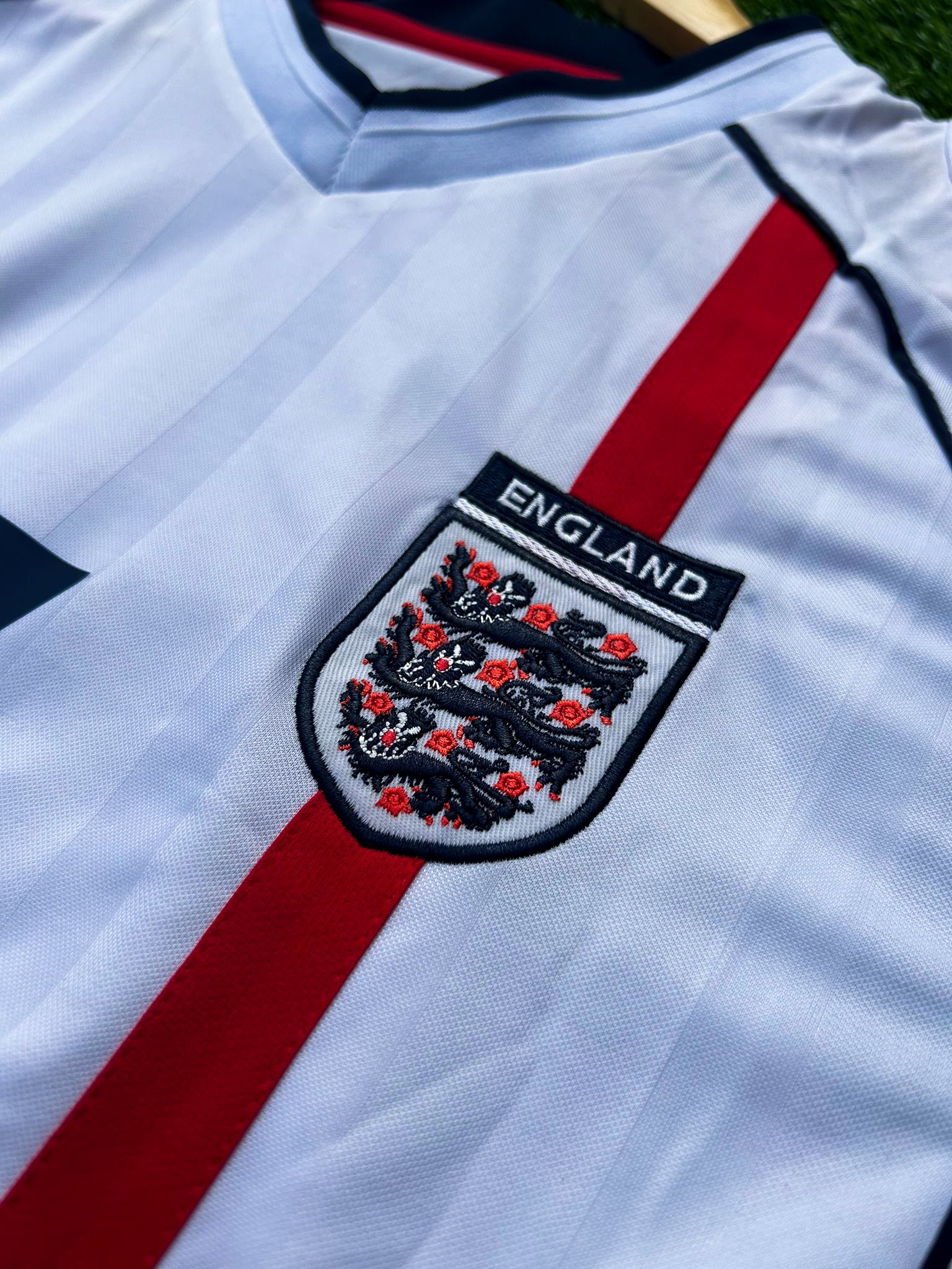 Close-up of the England crest and jersey fabric details.