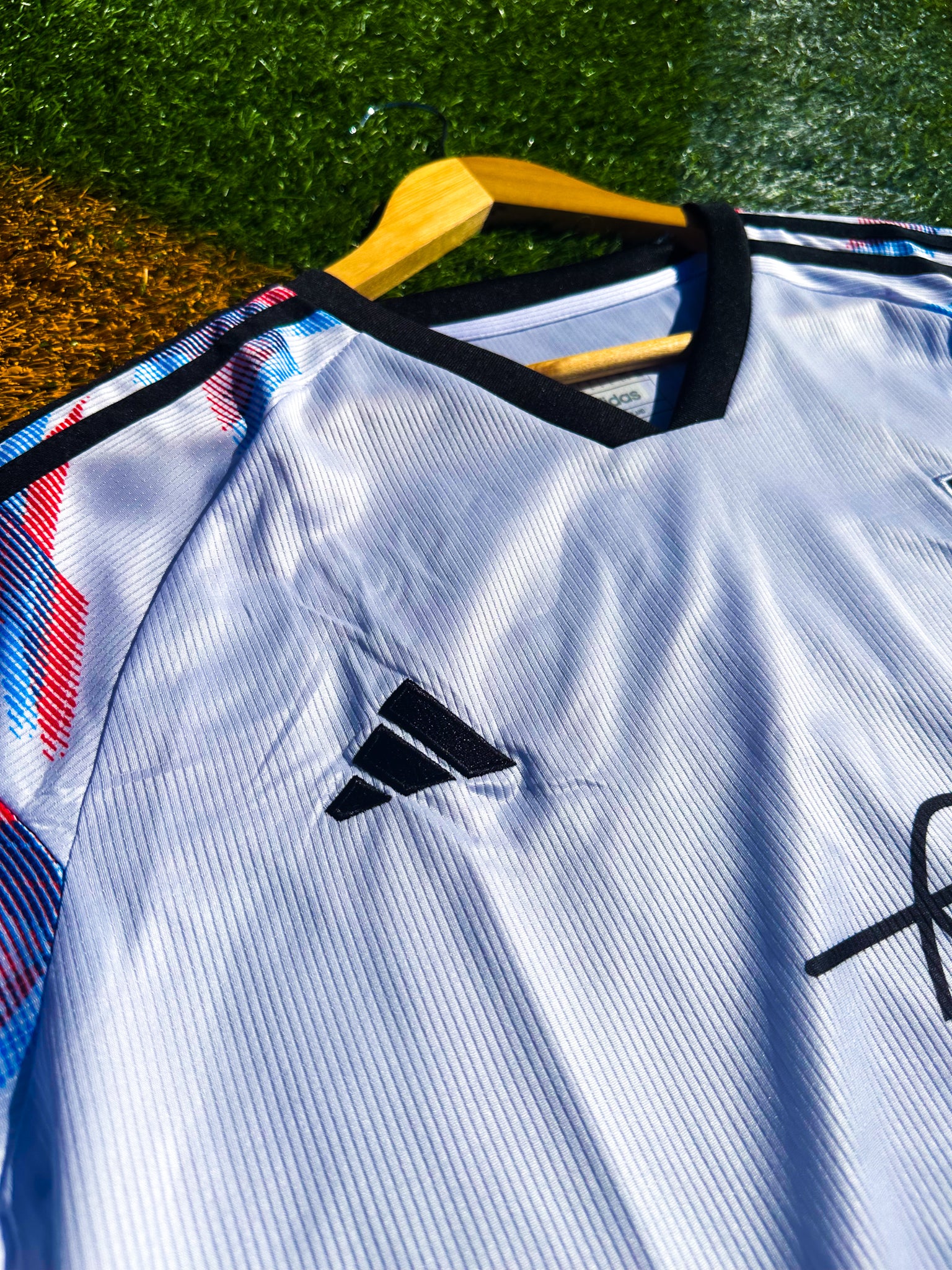Close-up of Naruto graphic and JFA crest

