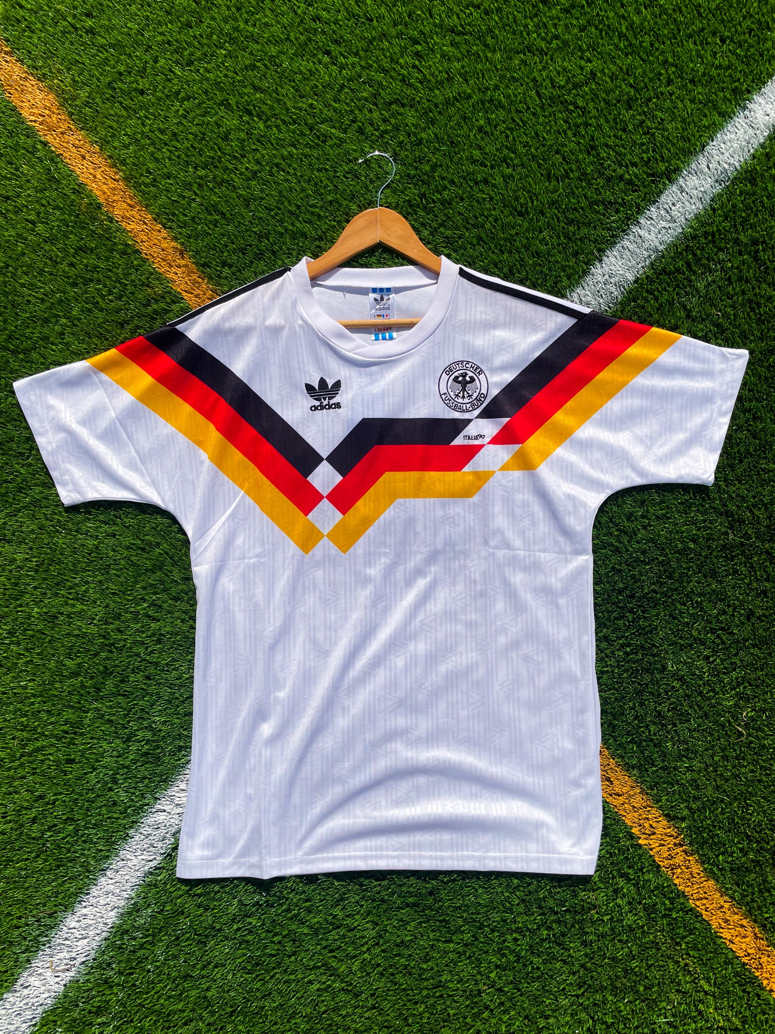 Front of Germany 1990 home jersey with tri-color chest stripes

