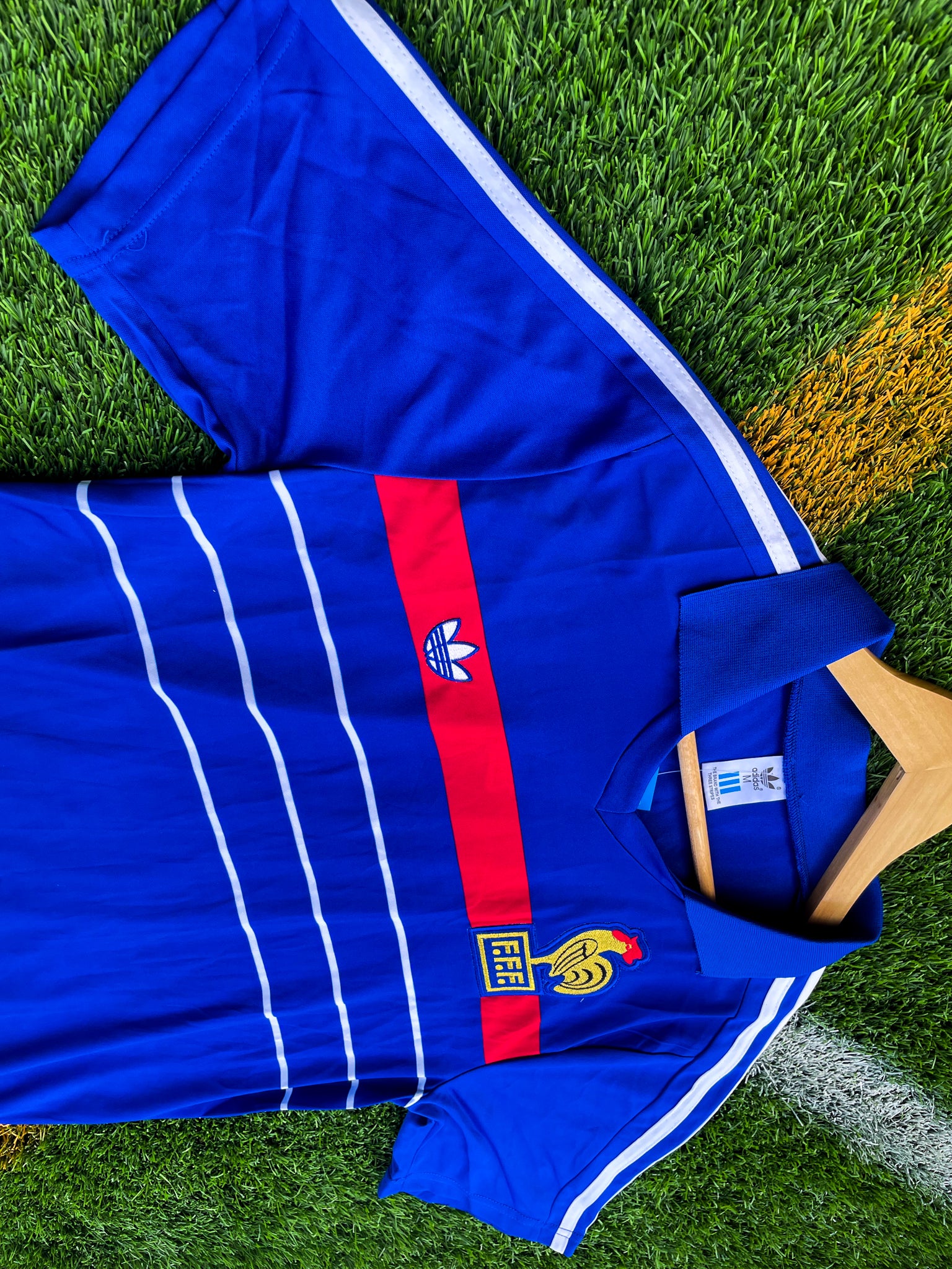 Close-up of FFF crest and Adidas trefoil on the jersey

