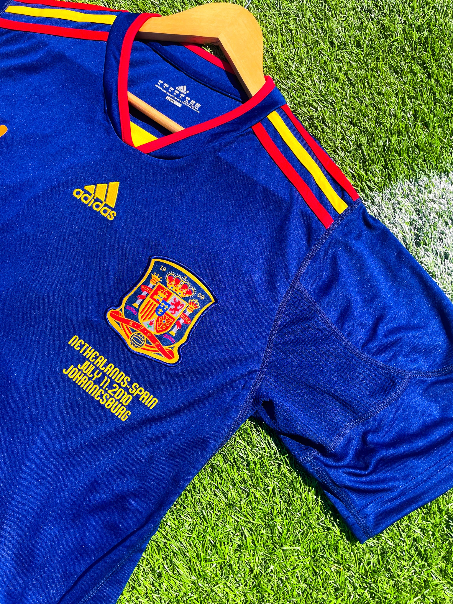 Detail shot of Spain crest and Adidas logo from 2010 Away kit

