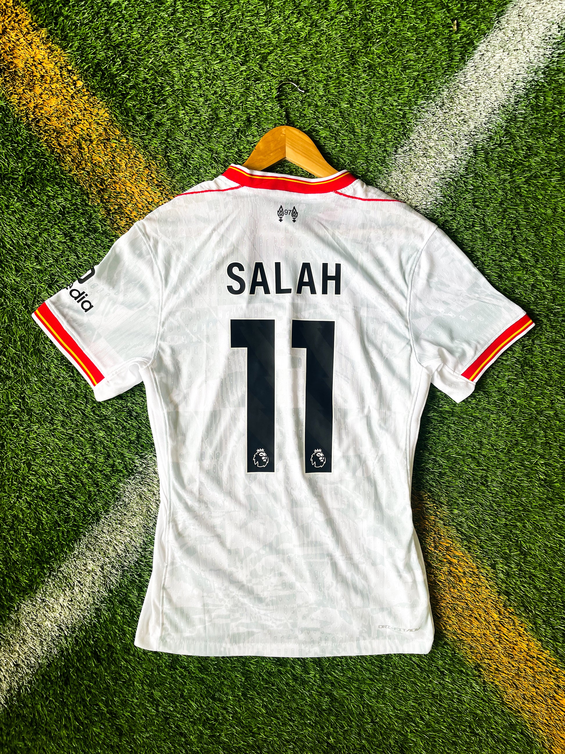 Back view showing Salah #11 or Alexander-Arnold #66 on white kit

